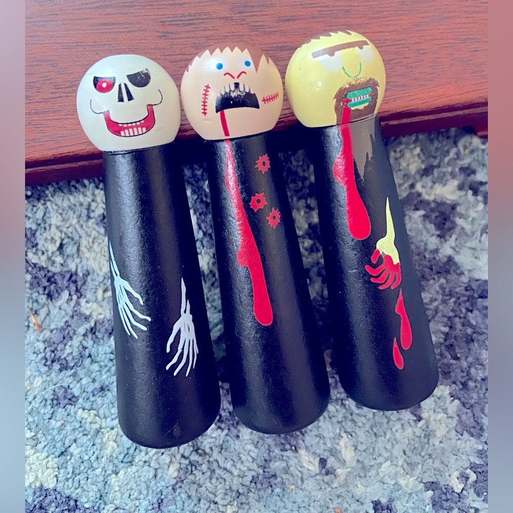 3 wooden peg dolls from Table Top Zombie Bowling by front Porch Classics